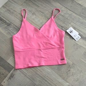 neon light pink crop top.